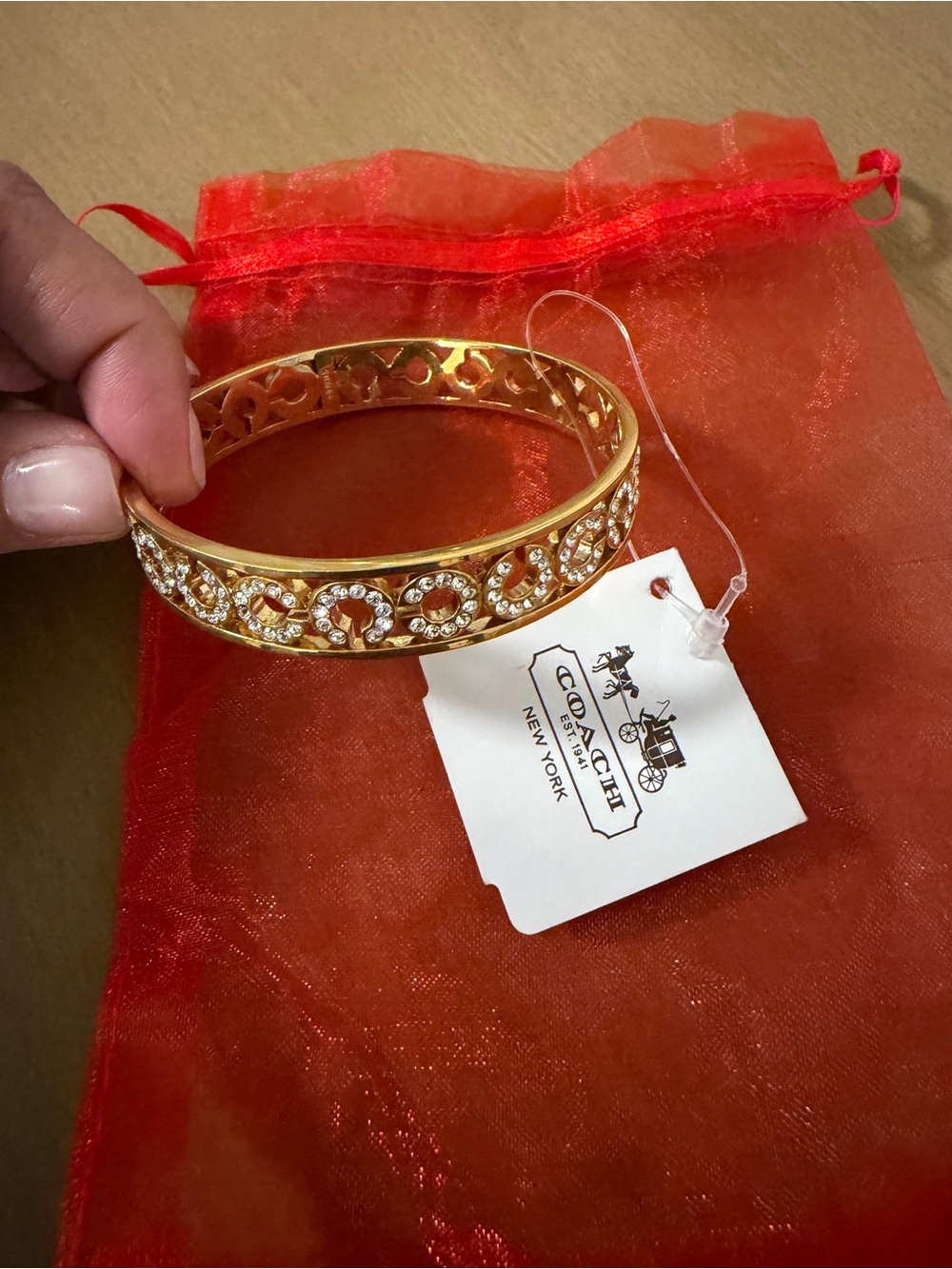 Coach Gold-tone Crystal Filigree Bangle Bracelet